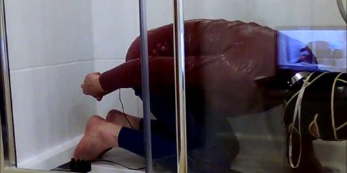 latex slave gives himself a  beer enema