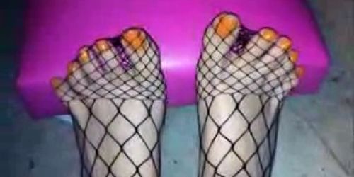 fishnets and orange nail polish..wmv