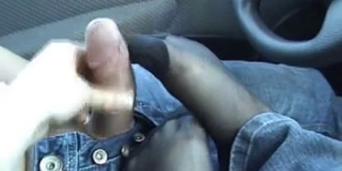 A footjob in nylons in the car