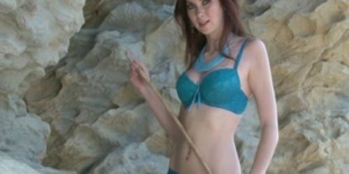 Ginger girl gets naked at a rocky beach