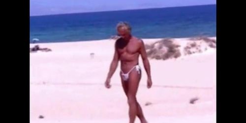 Tanned guy on beach in tiny string thong temporarily