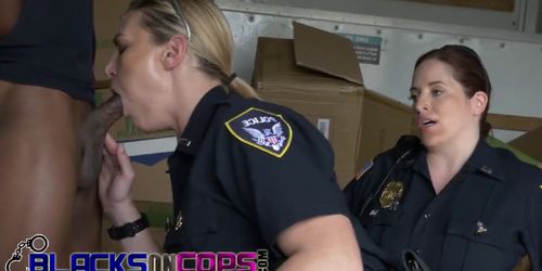 Black dude pounding two busty cops