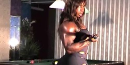 Sexy Black Female Bodybuilder wearing skirt