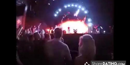 Public cock sucking at a concert