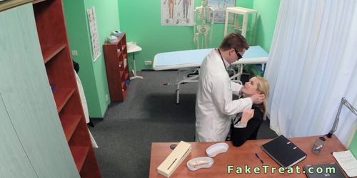 Doctor fucks sales woman on desk in fake hospital