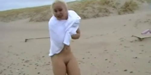 Daring Blond Bares All on a Cold Beach