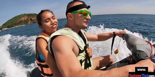 Asian girlfriend gives a blowjob in public on a jetski