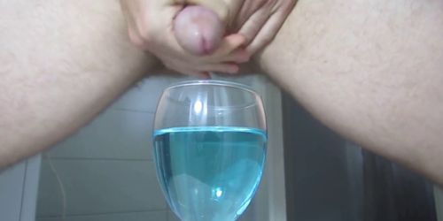 Ejaculating creamy cumshot into a cup of water 2