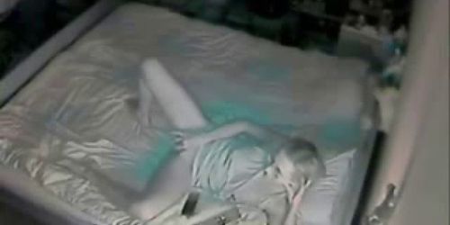 Hidden cam catches mom fingering on bed.