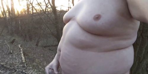 Chubby masturbates in the woods