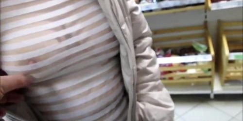 Touching tits in see-throu blouse in a market