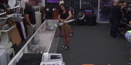 Teenager in need of cash flashing in pawnshop