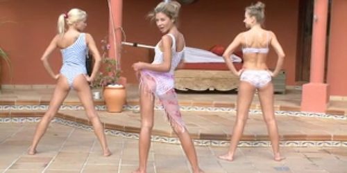 Three oiled lesbians have fun by the pool