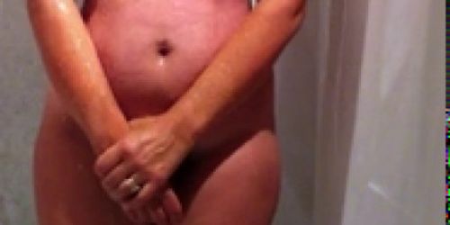 Hidden cam of sexy busty amateur MILF taking a shower p