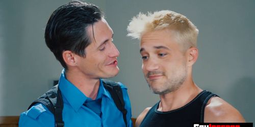 The officer bending him over his desk to open his hole