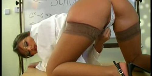 Horny teacher rubs pussy in classro