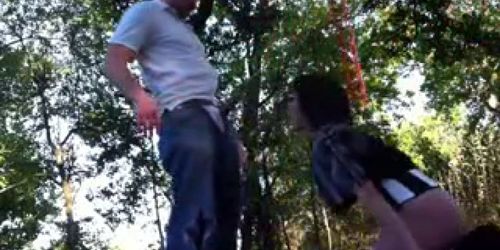 couple have fun with blowjob on public park swing