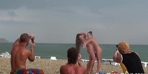 Voyeur on public beach Girls posing